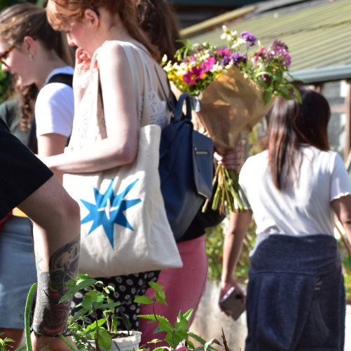 Shoppers browsing stalls at Windmill Hill Market.